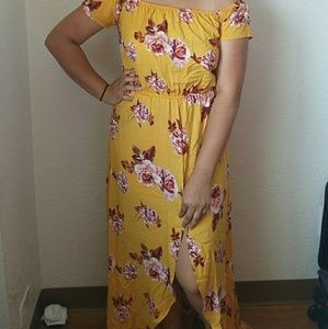Off the shoulder yellow floral design dress.